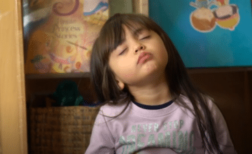 A young girl with closed eyes during a mindfulness practice