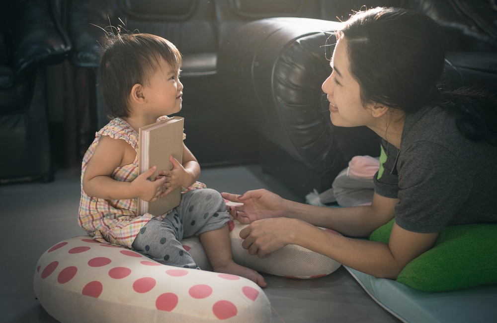 A parent talking to a frustrated toddler