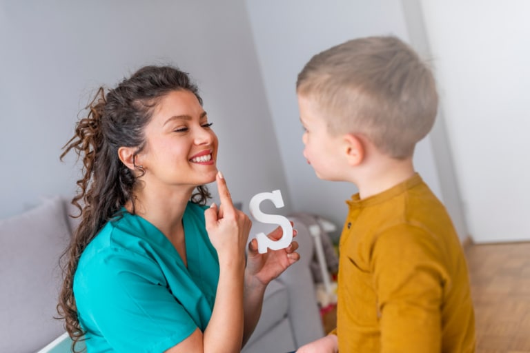 Early intervention therapist working on sounds with a toddler