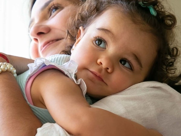 Mother and child hugging