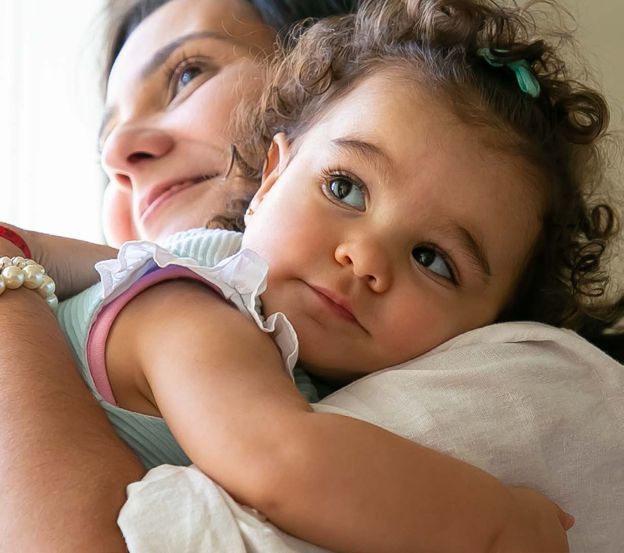 Mother and child hugging