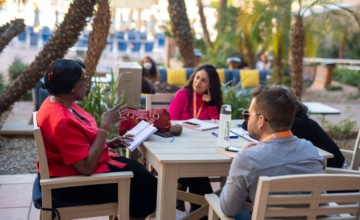 A group of professionals talking at a table