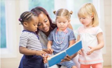 child care worker reading to toddlers