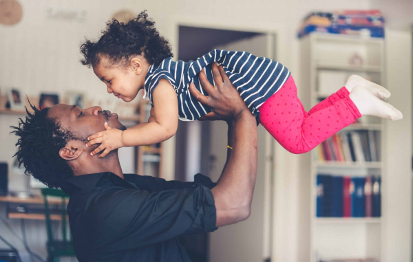 A young fatherhood a father playing with his daughter