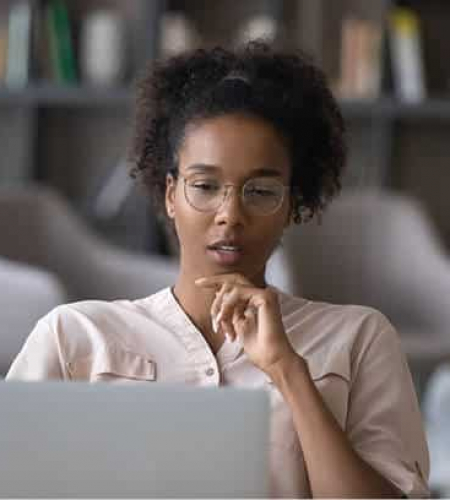 woman-working-on-laptop-in-library